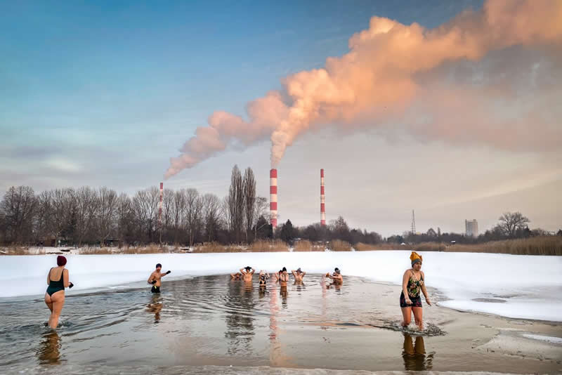 Urban Photo Awards 2026: 35 Finalist Photos That Turn Everyday Streets Into Art 51 Toxic Winter Swimming by Ewa Laskowska - Urban Photo Awards 2026 Street Finalists