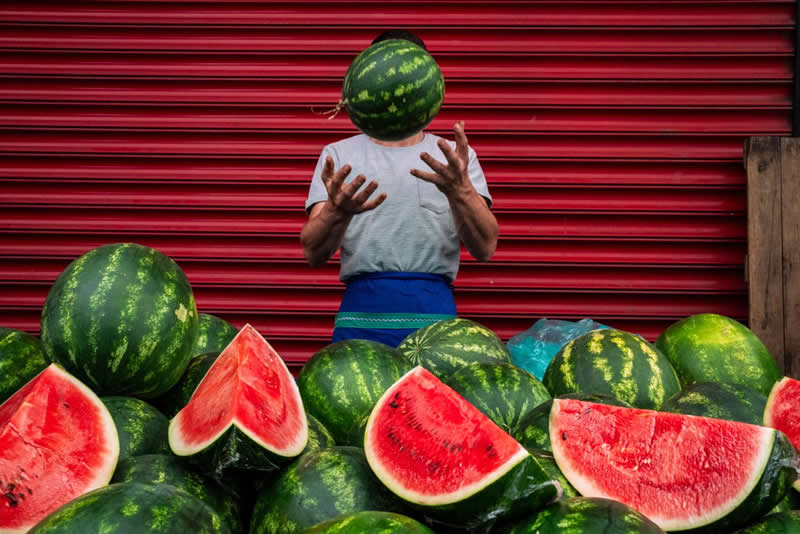 Urban Photo Awards 2026: 35 Finalist Photos That Turn Everyday Streets Into Art 64 The Melon Head by Jozef Macak - Urban Photo Awards 2026 Street Finalists