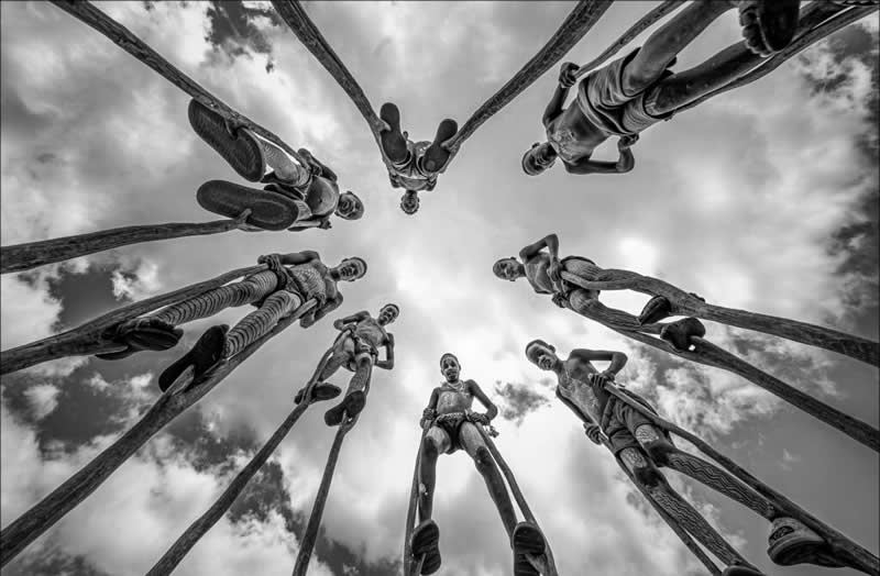 Open B&W - Jury Choice: Stick Walkers by Phillip Kwan, Canada - 12Awards Photography Competition Winners