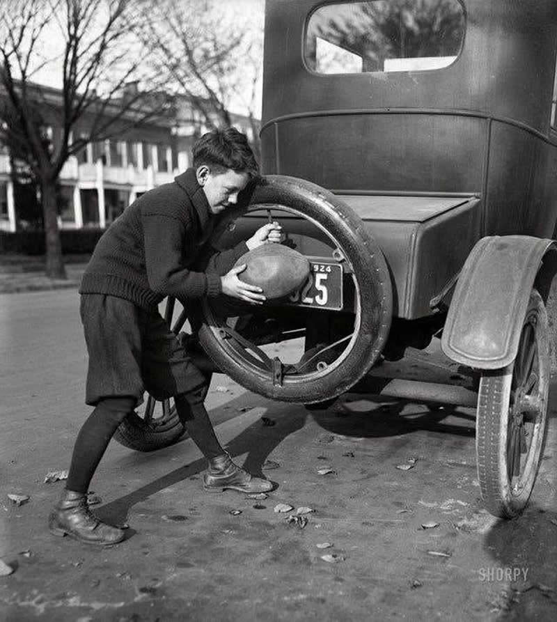 40 Historic Photos That Will Completely Change How You See the Past 63 Washington, D.C., 1924. 'Billy' Friel shown inflating his football by using someone's spare tire.