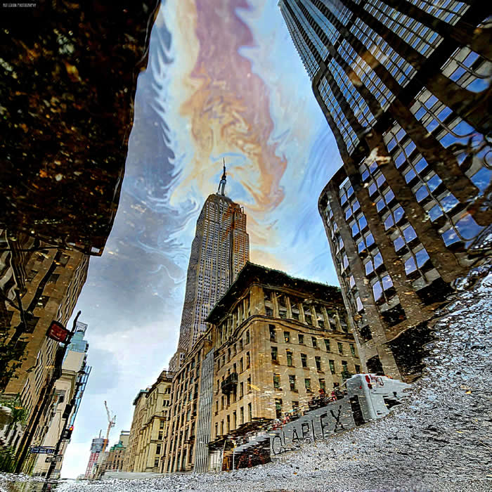 ITAP of the Empire State Building reflected in an oily puddle