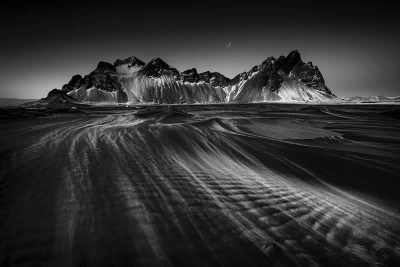 Earth in Elegant Monochrome: 40 Landscape Winners From the MonoVisions Awards 2026 72 Strong winds sweep across the black sand beach at Iceland Vestrahorn by Wei Lian, United States - MonoVisions Black and White Awards Landscape 2026 Winners