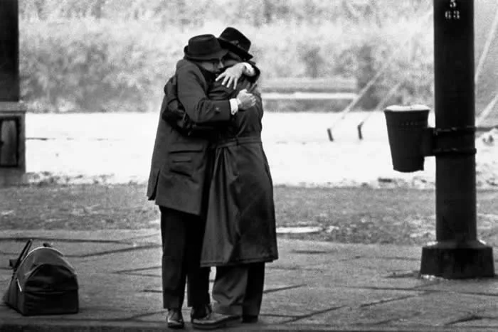 Two brothers meet after being separated by the Berlin Wall. Berlin, Germany, Christmas season 1963. (Photo by Ian Berry)