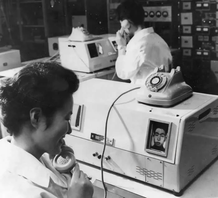 Japanese telephone operators in Tokyo using the new View Phone, made by Toshiba Shibaura Electric Co, with which they can see the caller, and the caller can see them. 1964