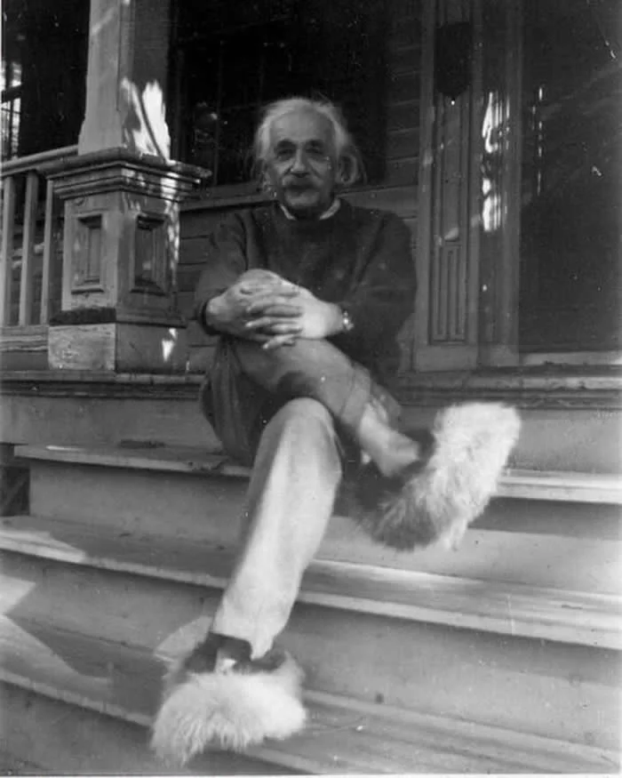 Albert Einstein wearing fuzzy slippers. (1940s)