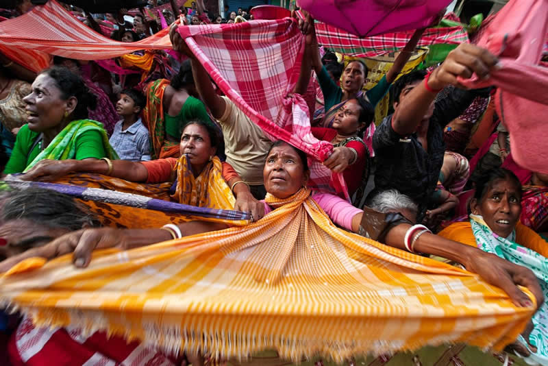 Reaching for Blessings by Ayanava sil - Urban Photo Awards 2026 People Fianlists