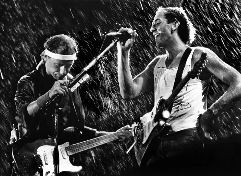 Photojournalism - Bronze: Dire Straits - 'Singing In The Rain' by Brian Cassey, Australia - Analog Sparks 2026 Winners