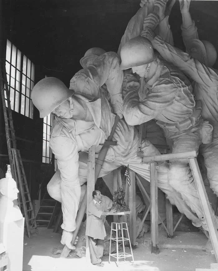 Sculptor Felix de Weldon working on the plaster model of the US Marine Corps War Memorial, circa 1954.