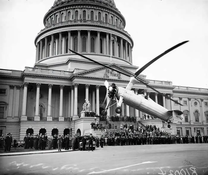 The &ldquo;autogyro&rdquo; an early plane-helicopter hybrid, taking off in front of the United States Capitol, Washington D.C., 1936.