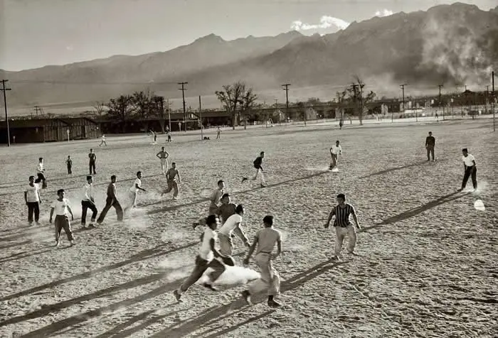 Japanese-American internees at the Manzanar War Relocation Center in California, playing football, 1943