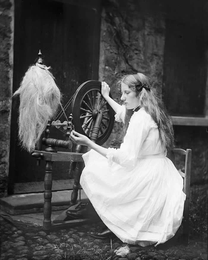 Young lady at a spinning wheel in Ireland, 1905.
