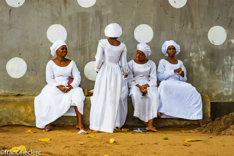 Capturing Humanity: Award-Winning Photographer France Leclerc Explores Life Around the World 41 Some ladies, followers of the Celeste Church, resting and chatting after attending a service - Street and Documentary Photography by France Leclerc