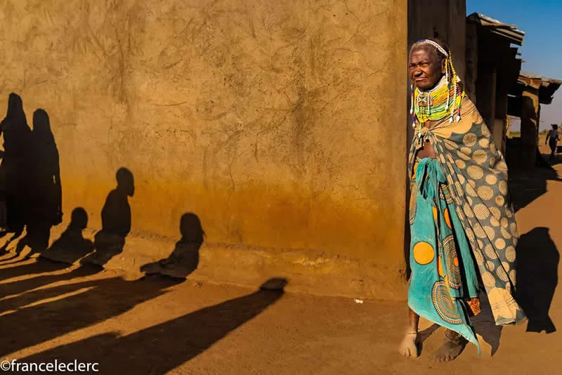 Capturing Humanity: Award-Winning Photographer France Leclerc Explores Life Around the World 48 A woman from the Ovamwila tribe arriving at the market near Lubango, Southern Angola - Street and Documentary Photography by France Leclerc