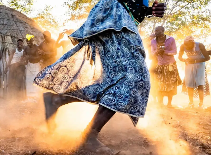Capturing Humanity: Award-Winning Photographer France Leclerc Explores Life Around the World 51 In Southern Angola, men from the Hakaona ethnic group dance at sunset - Street and Documentary Photography by France Leclerc