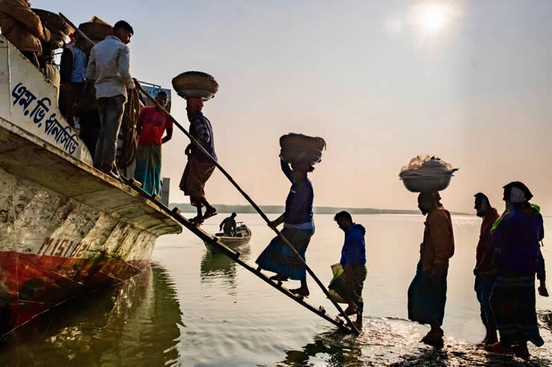Capturing Humanity: Award-Winning Photographer France Leclerc Explores Life Around the World 70 Head’s up, the hard way to carry a load, Bangladesh - Street and Documentary Photography by France Leclerc