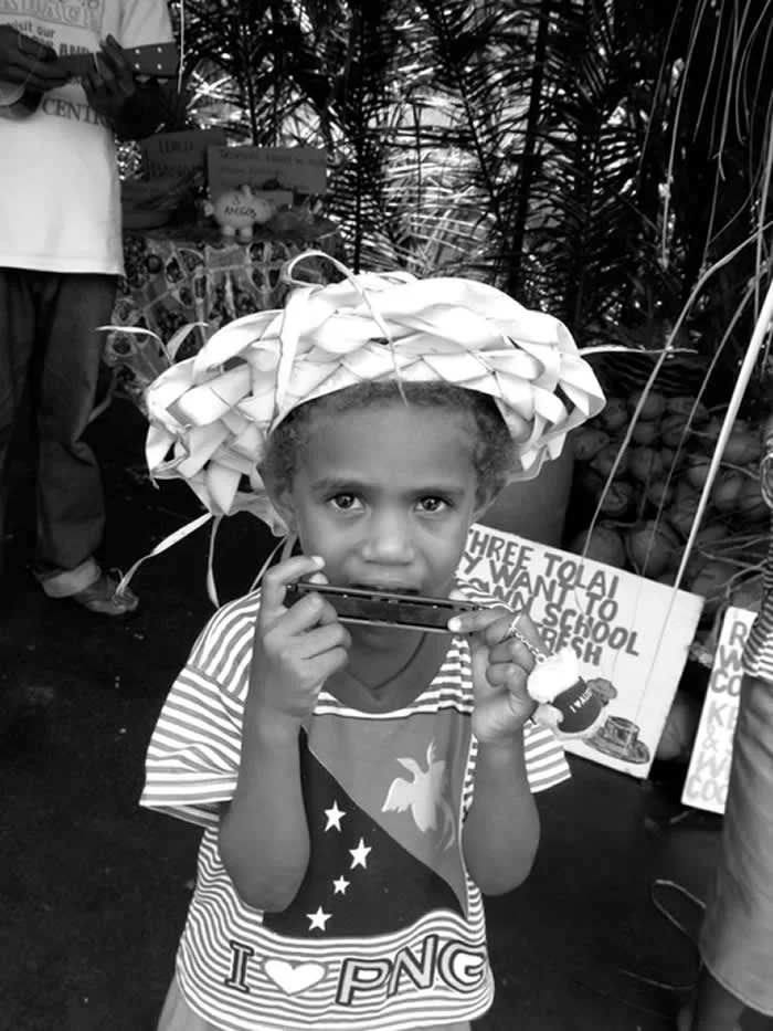 Harmonica Boy New Guinea by Karen Safer, USA - The Artist Gallery Awards 2026 Portrait Winners