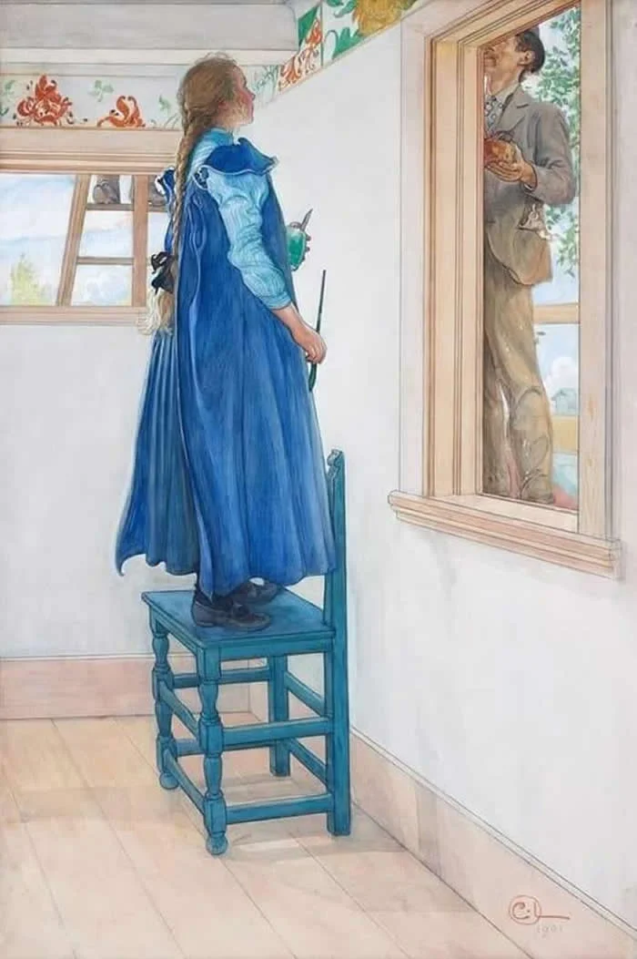 Carl Larsson&rsquo;s watercolor painting Suzanne and Another, depicting a young woman in a flowing blue dress standing on a wooden chair and looking through a window at a man outside, in a bright room decorated with floral details.