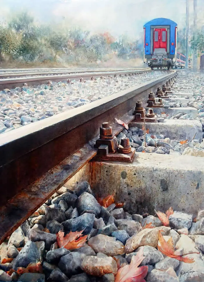Watercolor painting by Turkish artist Rukiye Garip titled Train Tracks, depicting a blue-and-red passenger train traveling along railway tracks, with detailed metal fasteners, gray stones, scattered autumn leaves, and soft, misty trees in the background.