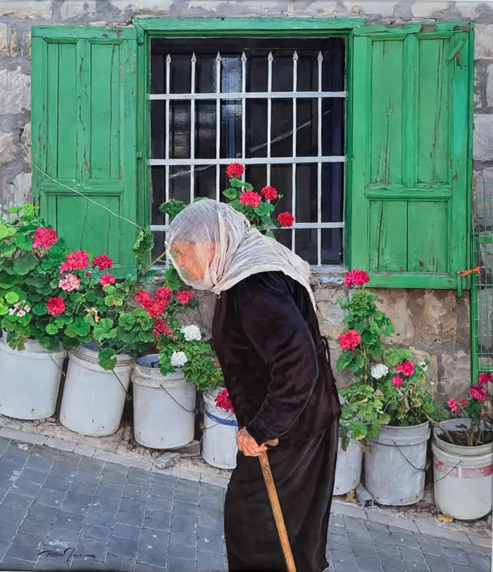 Watercolor painting by American artist Rance Jones titled Steep Road, depicting an elderly woman in a white headscarf and dark clothing leaning on a wooden cane, walking past red and pink flowers beneath green wooden shutters.