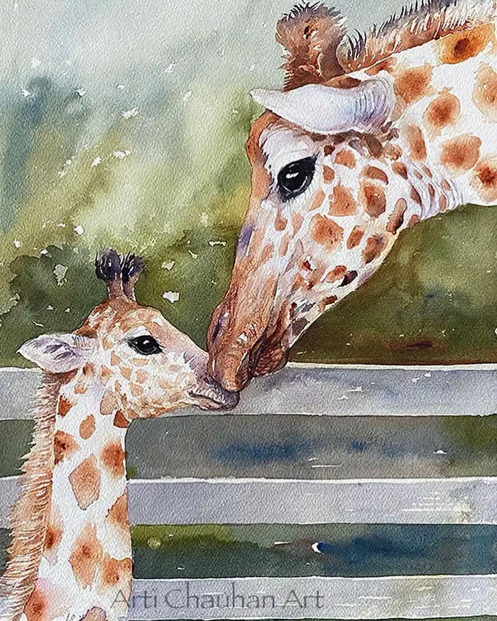 Watercolor painting by Indian artist Arti Chauhan titled A Gentle Nuzzle, depicting a mother giraffe affectionately touching noses with her young calf over a wooden fence, with expressive brown spots and soft green background washes.